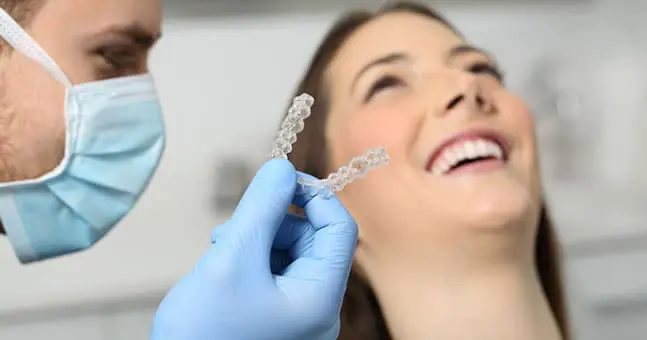 Woman Smiling with Braces for Teeth near Harrison Township MI
