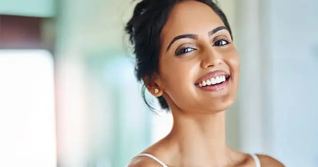 Woman Smiling After Visiting A Top Dentist in Chesterfield MI