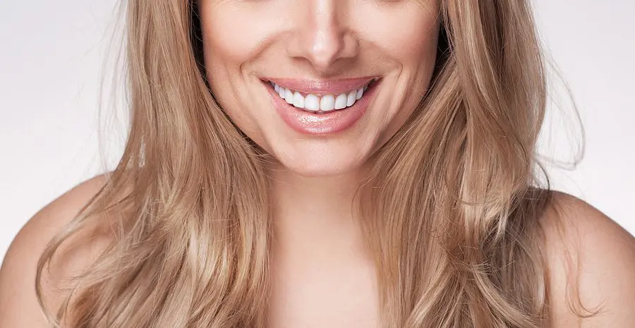 Healthy White Smile Close Up. Adult Beautiful Blond Woman With W