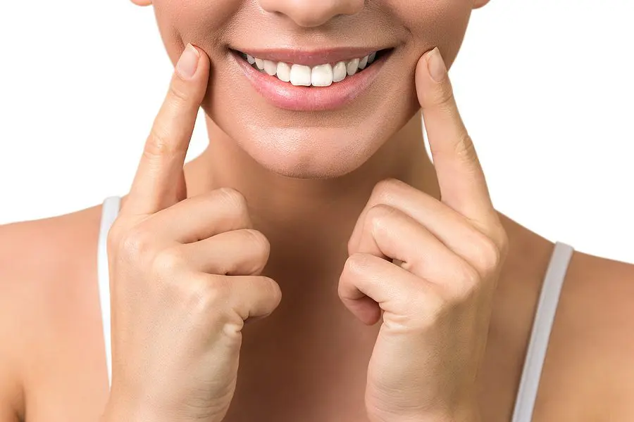 Lip Protection. Isloated Close Up Of A Young Woman Beautiful Smi