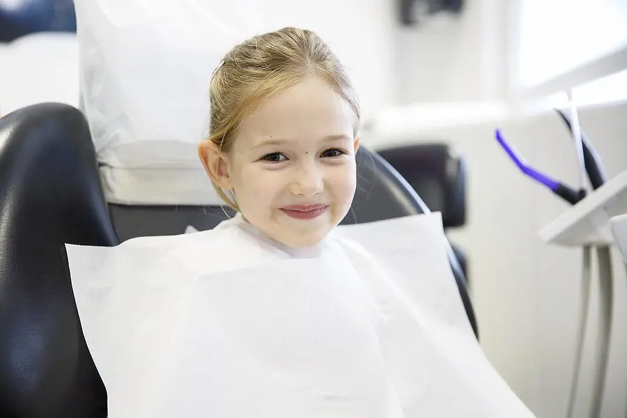 Smiling Little Girl In The Dental Office. Prevention, Pediatric