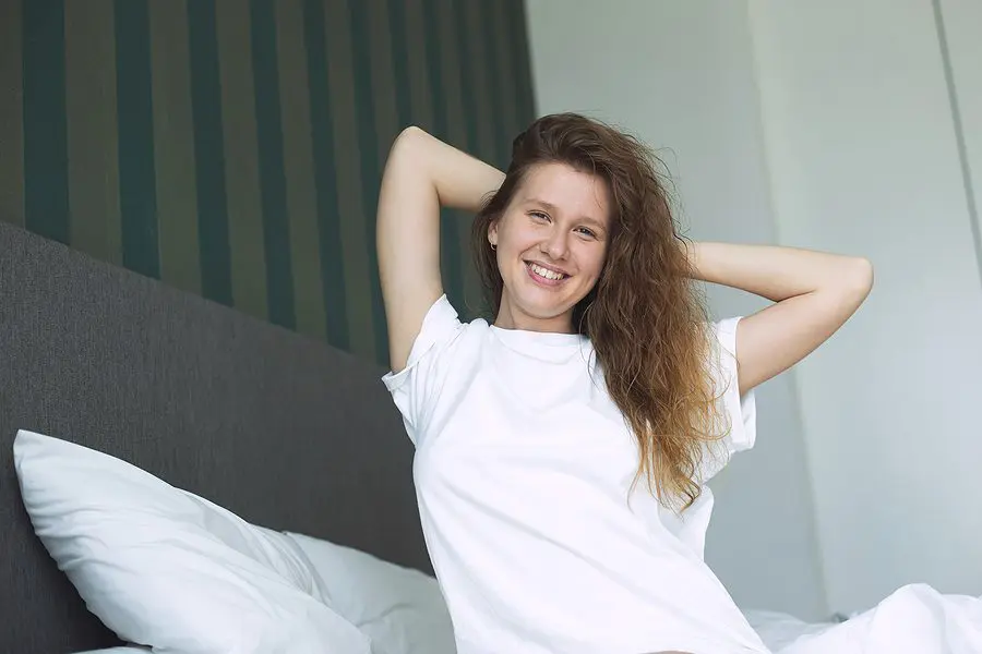 Young Happy Beautiful Sleepy Woman In The Bed In Bedroom At Home