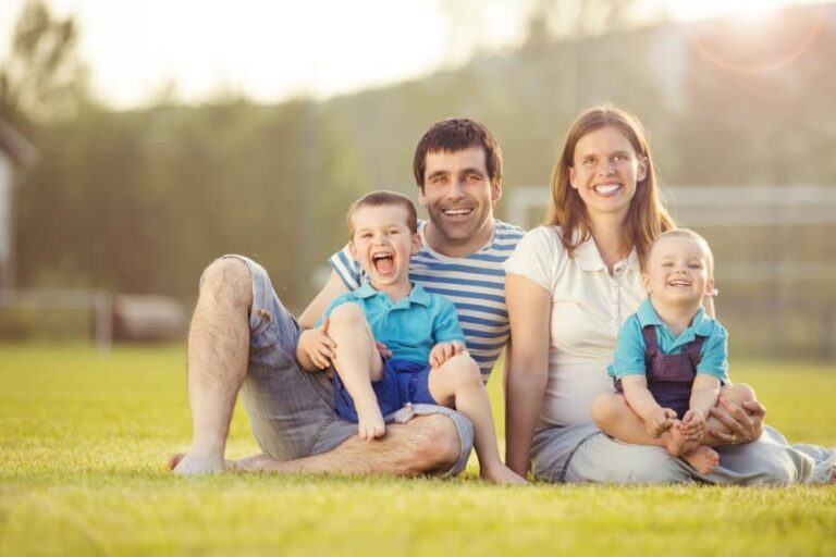 Happy Family Relaxing In Summer