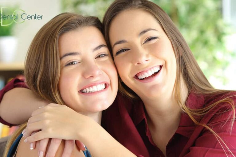 two girls smiling happily