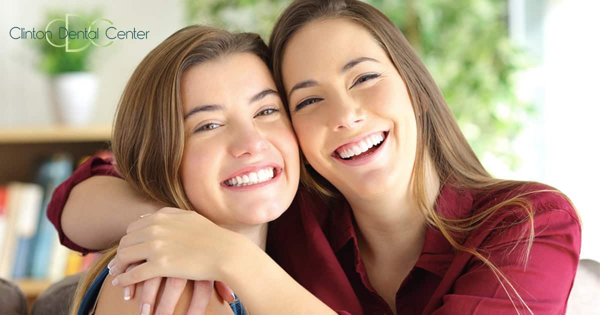 two girls smiling happily