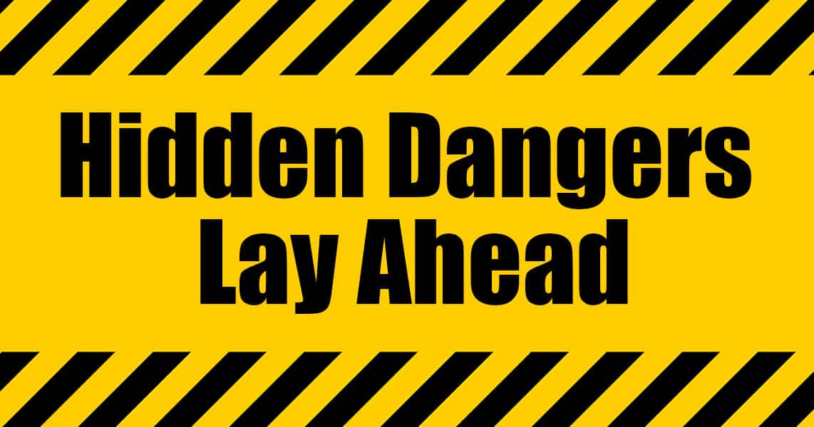 warning sign that says, "Hidden dangers lay ahead"