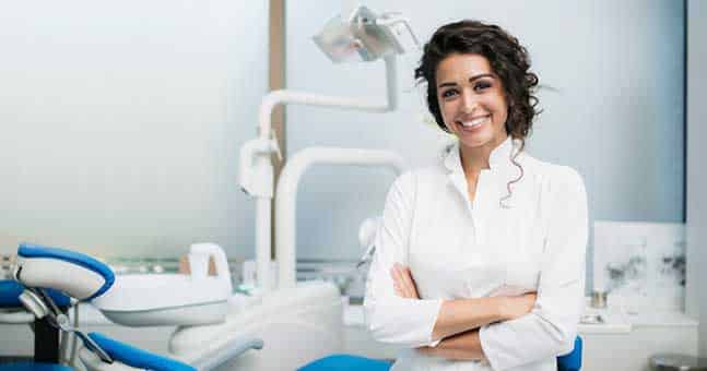 Woman Smiling in Dental Office for Affordable Braces in Chesterfield MI