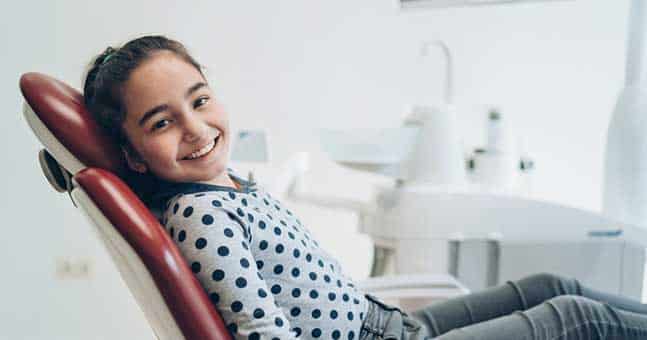 Girl In Dentist Chair Seeing Orthodontist for Children in Chesterfield MI