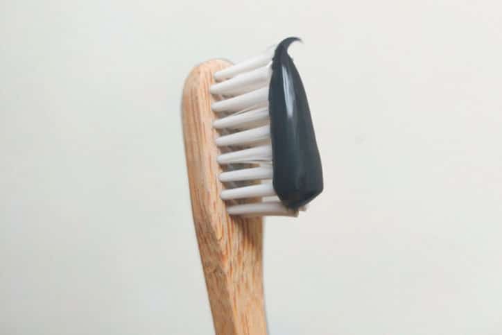wood Toothbrush with black charcoal toothpaste