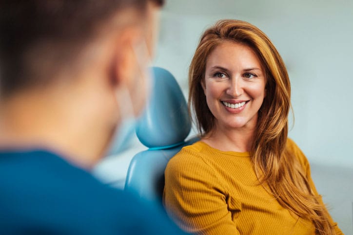 Woman Smiling at Dentist