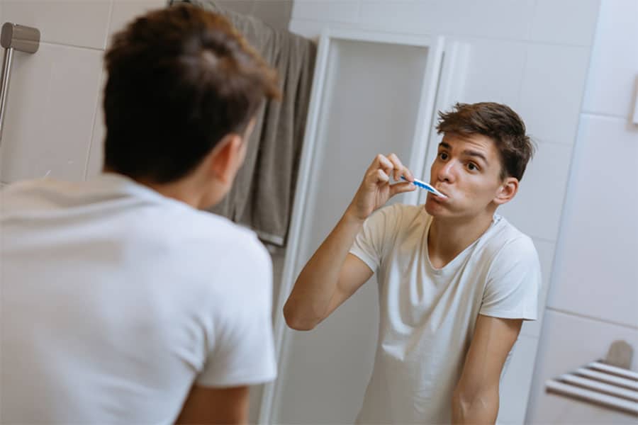 Teen Brushing Teeth